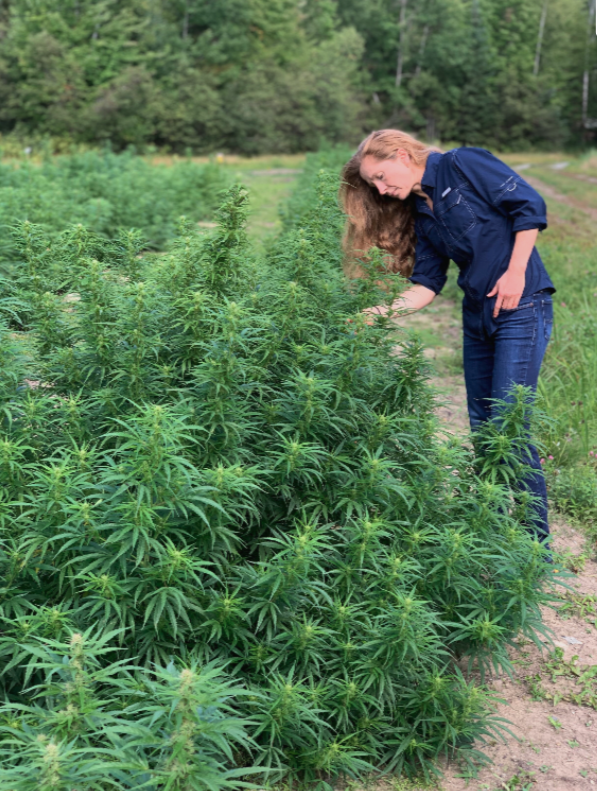 Tanya, the owner of Ridge Hemp, tending to her hemp crop.